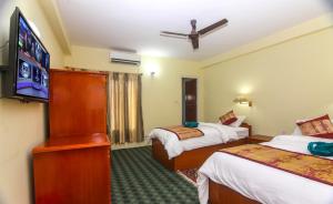 Llit o llits en una habitació de Hotel Noble Inn花椒客栈