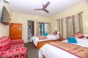 Llit o llits en una habitació de Hotel Noble Inn花椒客栈