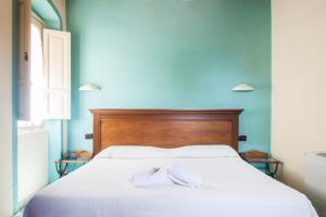 Voodi või voodid majutusasutuse Corte Fiorita Albergo Diffuso toas