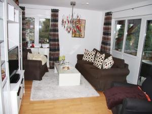 a living room with two couches and a table at Ferienwohnung Christa in Sankt Märgen