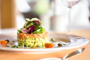 a plate of food on a table at Hipotels Playa La Barrosa - Adults Only in Chiclana de la Frontera