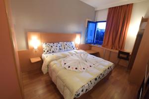 Letto o letti in una camera di Senator Hotel Tanger