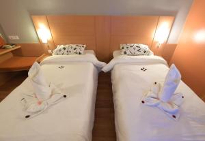 Letto o letti in una camera di Senator Hotel Tanger