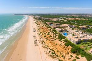 an aerial view of a beach with condos at Hipotels Playa La Barrosa - Adults Only in Chiclana de la Frontera