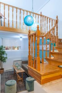 a staircase in a living room with a stair case at O'Donnell in Madrid