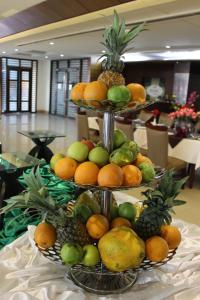 a three tiered fruit display on a table at Civic Inn in Dhaka