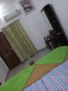 Postel nebo postele na pokoji v ubytování Angelann Homestay