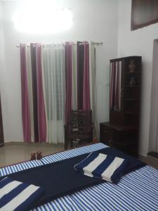 Postel nebo postele na pokoji v ubytování Angelann Homestay