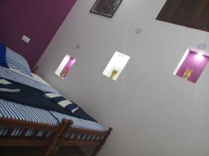 Postel nebo postele na pokoji v ubytování Angelann Homestay