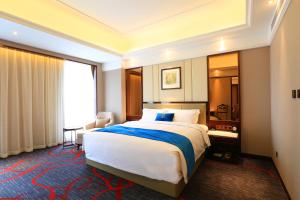 Katil atau katil-katil dalam bilik di Xi'an Lanxi International Hotel