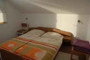 A bed or beds in a room at Guest Accomodation Škerlak
