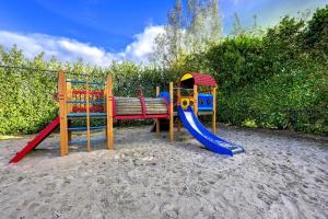 a playground with a bench and a slide at Vesting de Bronsbergen in Zutphen +34 photos
