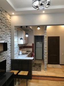 a kitchen with a table and a counter top at Kaskad apartment and Tours in Yerevan