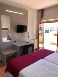 Postel nebo postele na pokoji v ubytování Hotel Valjunco