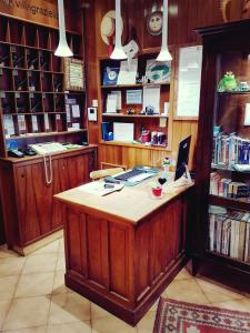 a library with a desk with a laptop on it at Antica Villa Graziella in Marghera