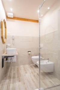 a bathroom with a toilet and a sink and a tub at Agriturismo Ca' Zerbetto in Bardolino +30 photos