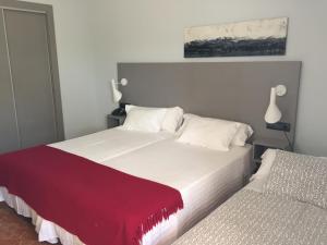 Postel nebo postele na pokoji v ubytování Hotel Valjunco