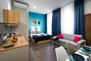 Posteľ alebo postele v izbe v ubytovaní Kings City - Sławkowska Apartments