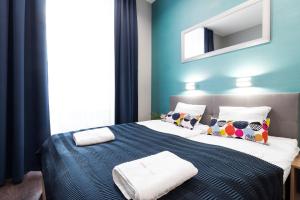 Posteľ alebo postele v izbe v ubytovaní Kings City - Sławkowska Apartments