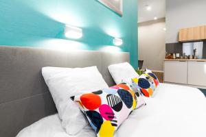 Posteľ alebo postele v izbe v ubytovaní Kings City - Sławkowska Apartments