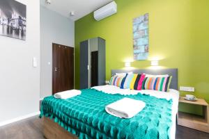 Posteľ alebo postele v izbe v ubytovaní Kings City - Sławkowska Apartments