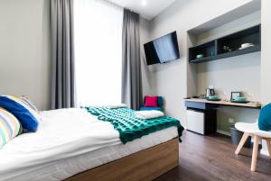 Posteľ alebo postele v izbe v ubytovaní Kings City - Sławkowska Apartments