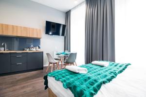 Posteľ alebo postele v izbe v ubytovaní Kings City - Sławkowska Apartments