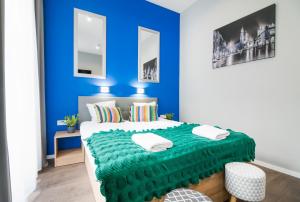 Posteľ alebo postele v izbe v ubytovaní Kings City - Sławkowska Apartments