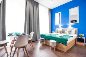 Posteľ alebo postele v izbe v ubytovaní Kings City - Sławkowska Apartments