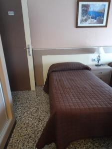 Posteľ alebo postele v izbe v ubytovaní Hostal Internacional