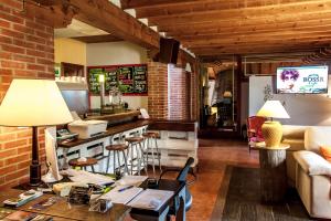 a living room with a couch and a table at Enclave Soria in Herreros