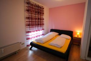 Postel nebo postele na pokoji v ubytování Hotel Ahrberg Viertel