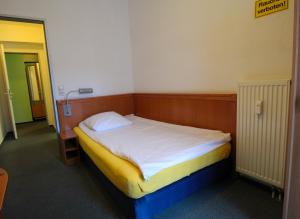Postel nebo postele na pokoji v ubytování Hotel Ahrberg Viertel