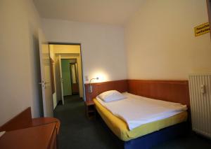 Postel nebo postele na pokoji v ubytování Hotel Ahrberg Viertel