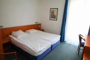 Postel nebo postele na pokoji v ubytování Hotel Ahrberg Viertel