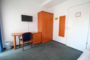 TV a/nebo společenská místnost v ubytování Hotel Ahrberg Viertel