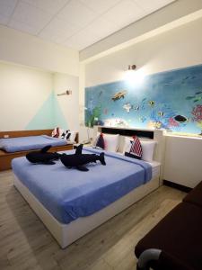 Letto o letti in una camera di Sabai B&B 澎湖船家寶民宿