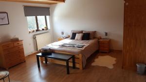 Rúm í herbergi á B&B Circuitez-vous