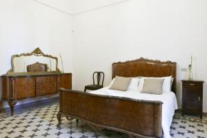 Postel nebo postele na pokoji v ubytování La casa dell'Avvocato by Wonderful Italy