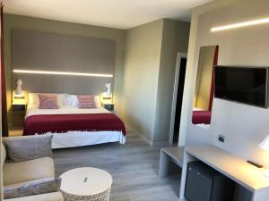 Postel nebo postele na pokoji v ubytování Hotel Valjunco