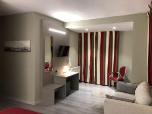 TV a/nebo společenská místnost v ubytování Hotel Valjunco