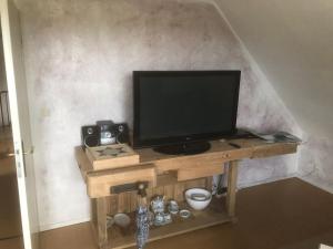 TV a/nebo společenská místnost v ubytování Haus Toquard