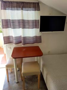 TV a/nebo společenská místnost v ubytování Apartments Marko