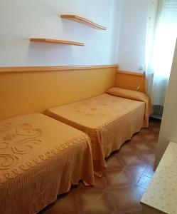 Postel nebo postele na pokoji v ubytování Appartamenti Falco