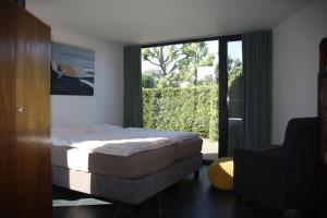 Voodi või voodid majutusasutuse La Chambre d'Amis toas
