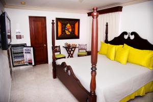 Postel nebo postele na pokoji v ubytování Hotel Los Jardines