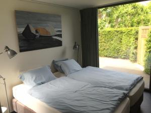 Voodi või voodid majutusasutuse La Chambre d'Amis toas