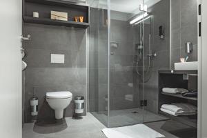 Ванна кімната в Oliver Apartments | contactless check-in