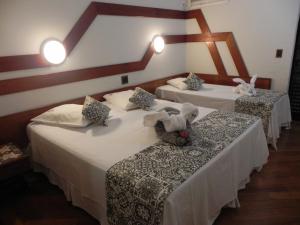 Cama ou camas em um quarto em Serra Negra Paladium Hotel