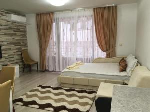 Кровать или кровати в номере Apartment Park Comfort